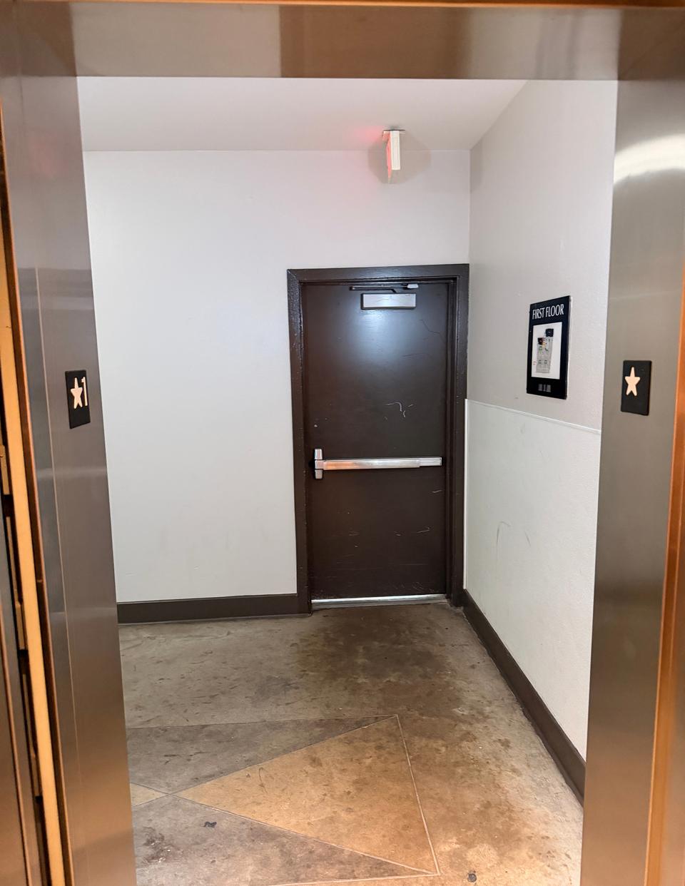 The first floor seen from inside the elevator, facing the door you come in through