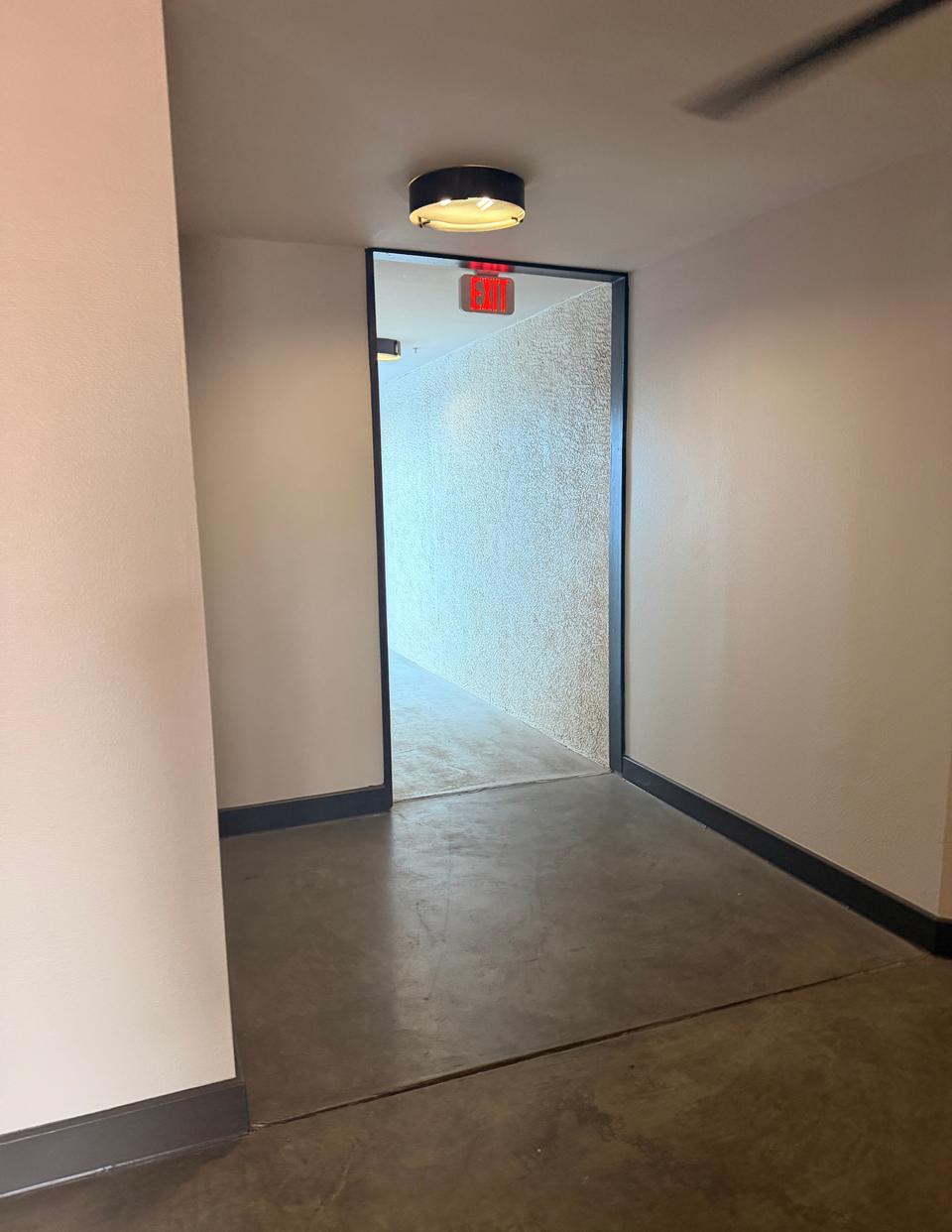 An open doorway just past the elevator