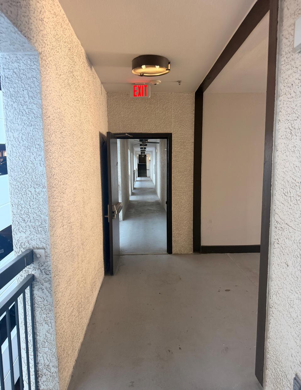 A hallway with an open doorway straight ahead