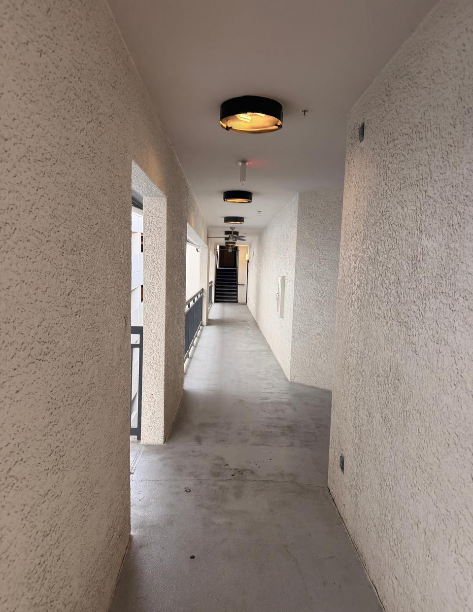 A long hallway with the bridge walkway openings on the left